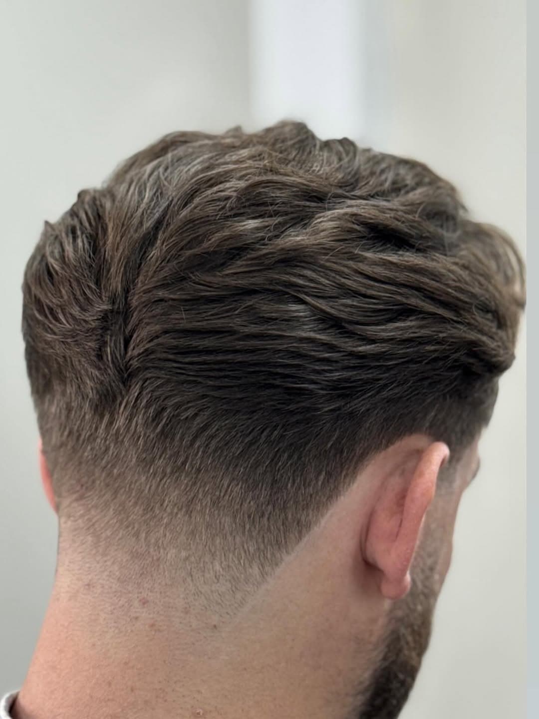 Taper fade met textured top, achteraanzicht – The Fade Veenendaal
